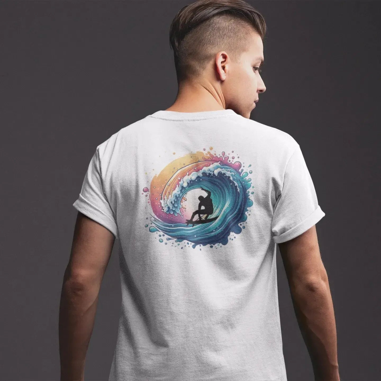Person wearing a white t-shirt with a colorful graphic on the back against a dark background
