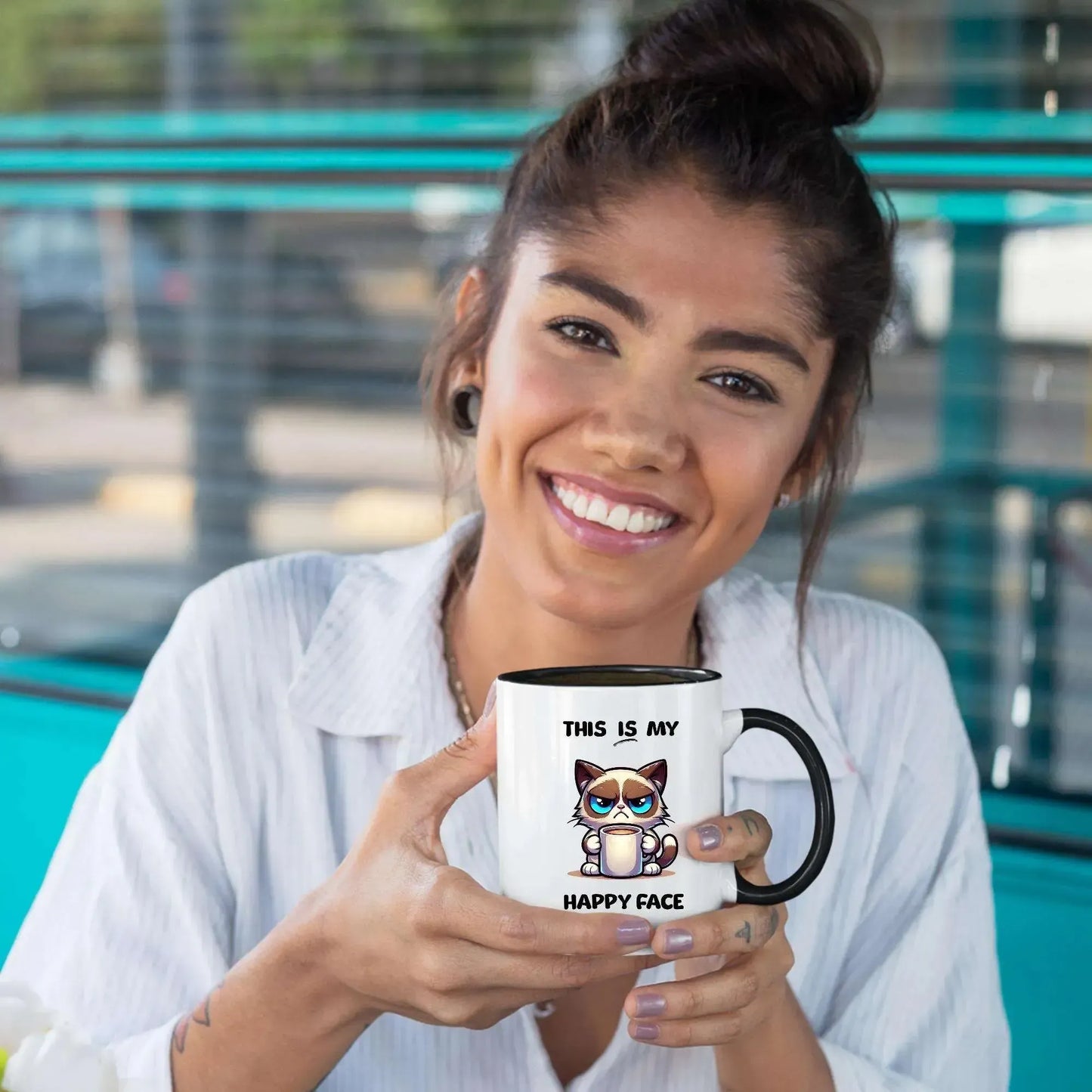 young-woman-holding-cute-cartoon-cat-mug
