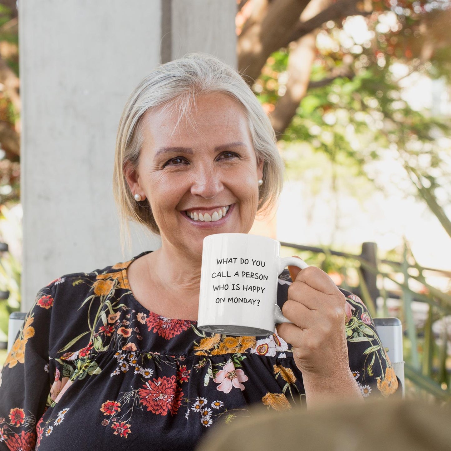 smiling-old-woman-holding-funny-retirement-mug