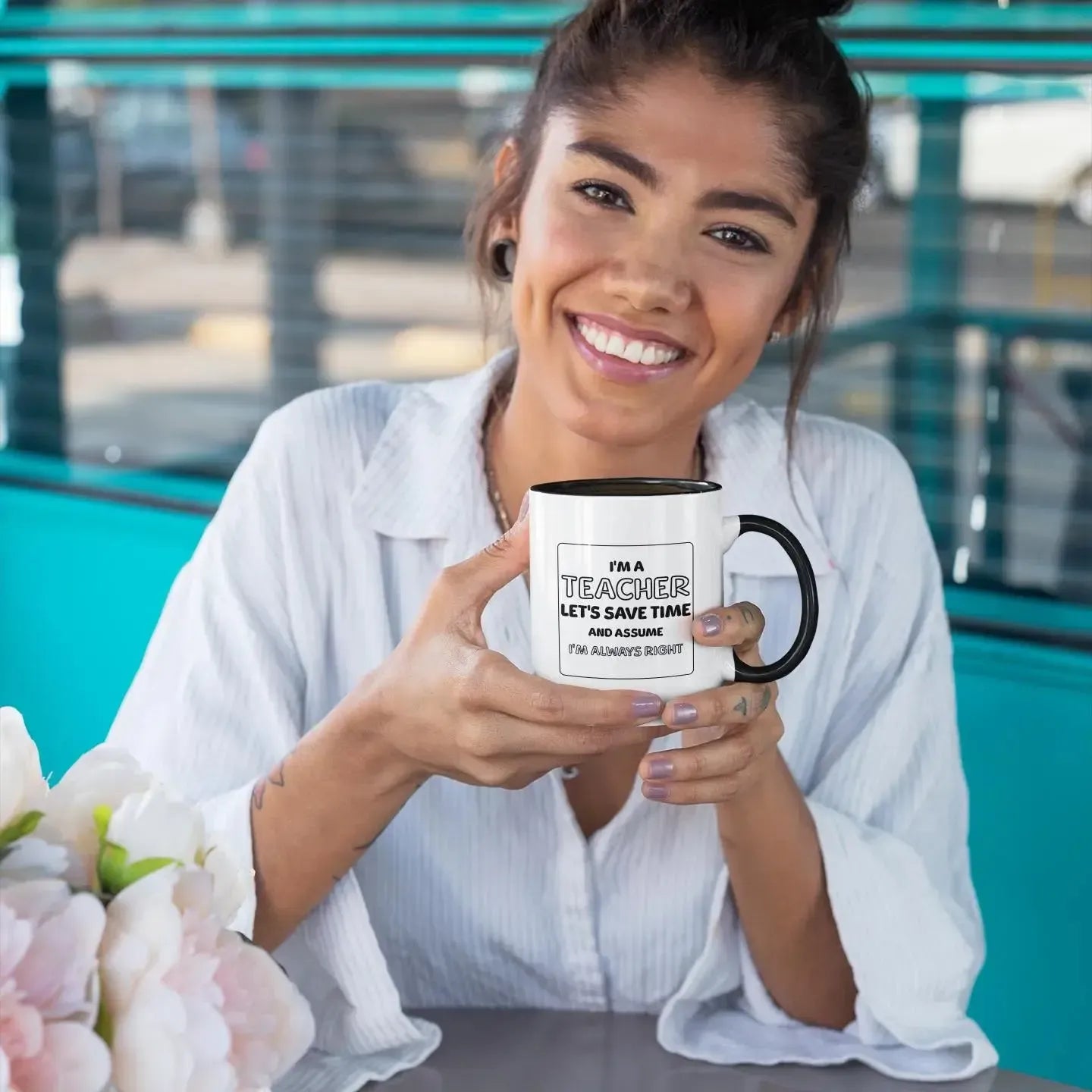 smiling-woman-holding-funny-teacher-quote-mug