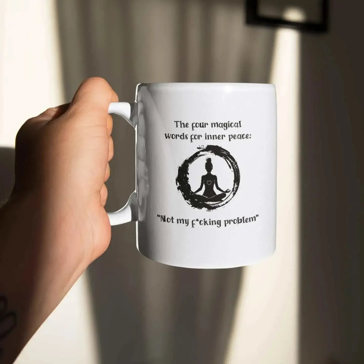 closeup-hand-holding-rude-yoga-mug