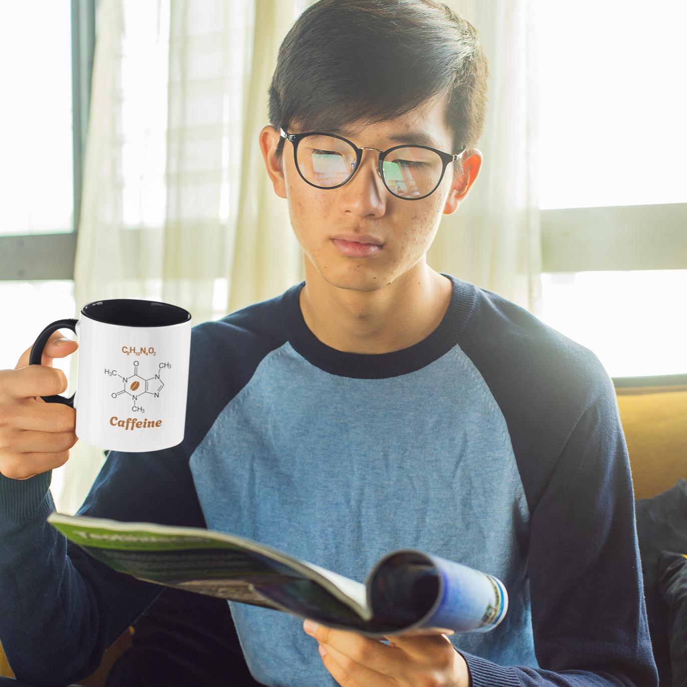 guy-reading-holding-funny-caffeine-molecule-mug 