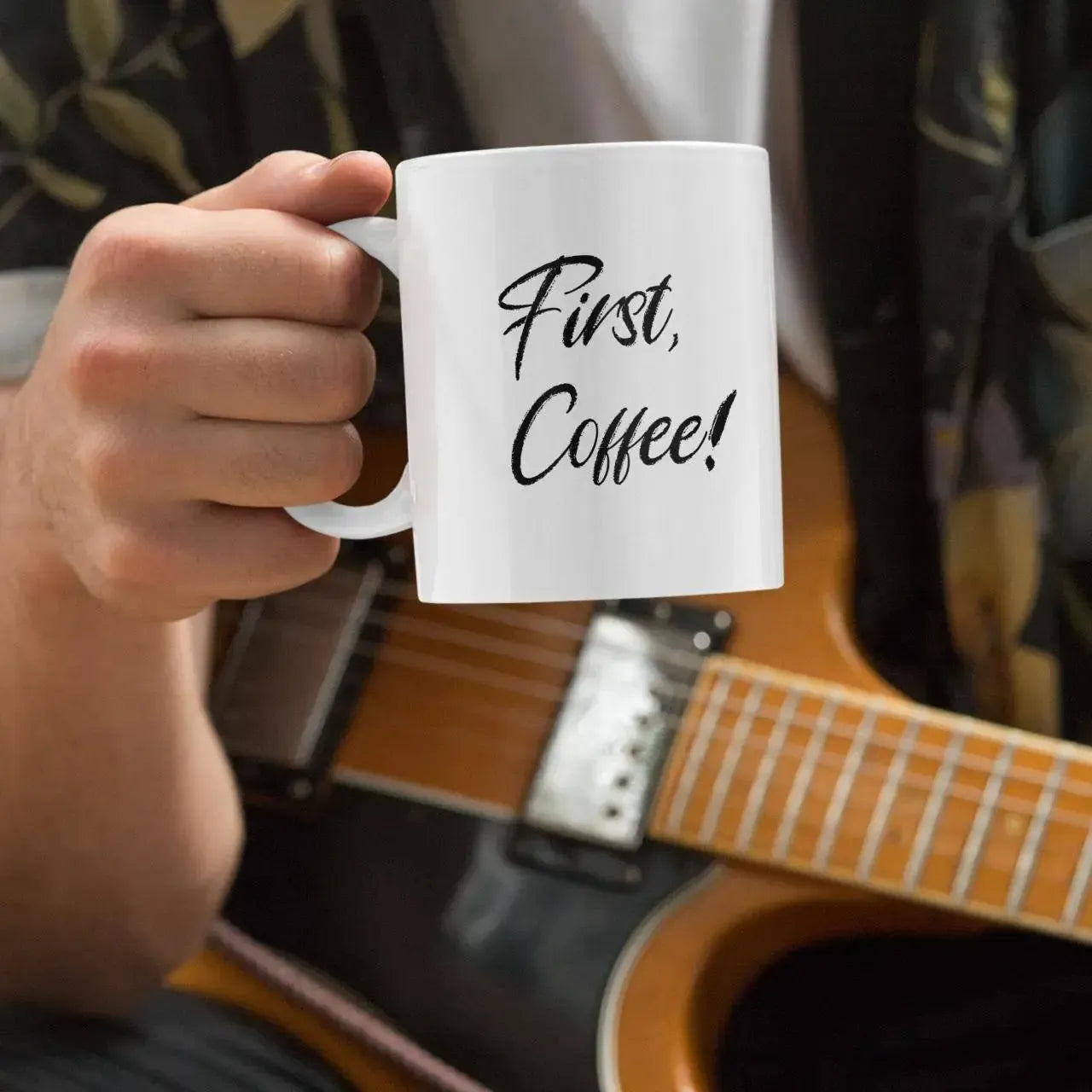 closeup-guitarist-holding-coffee-mug