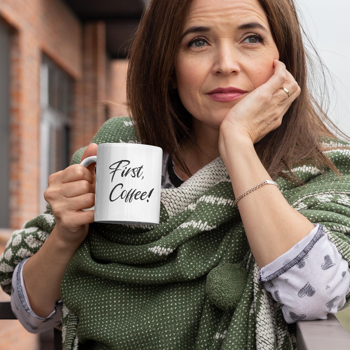reflective-woman-outdoors-holding-first-coffee-quote-mug