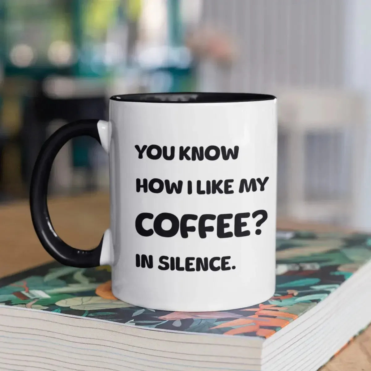 funny-text-coffee-mug-on-book