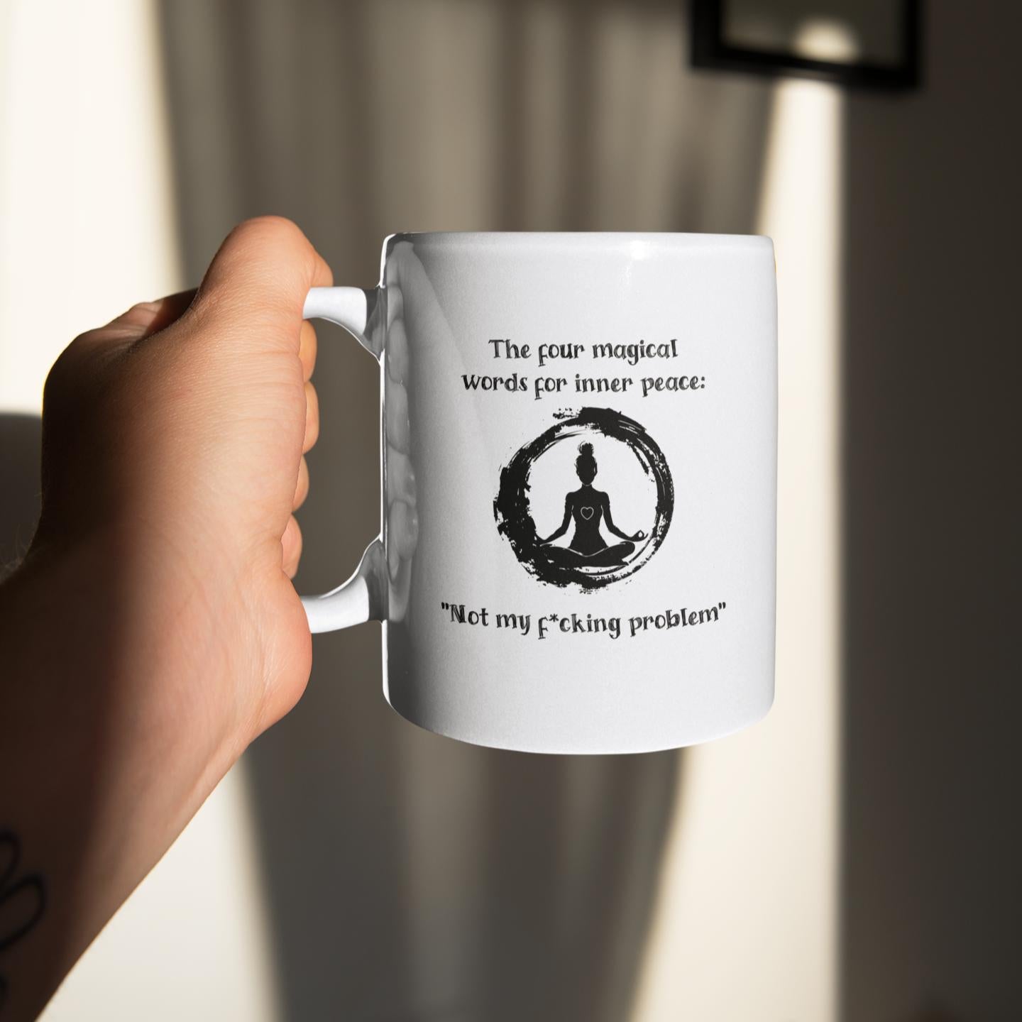 closeup-hand-holding-rude-yoga-mug