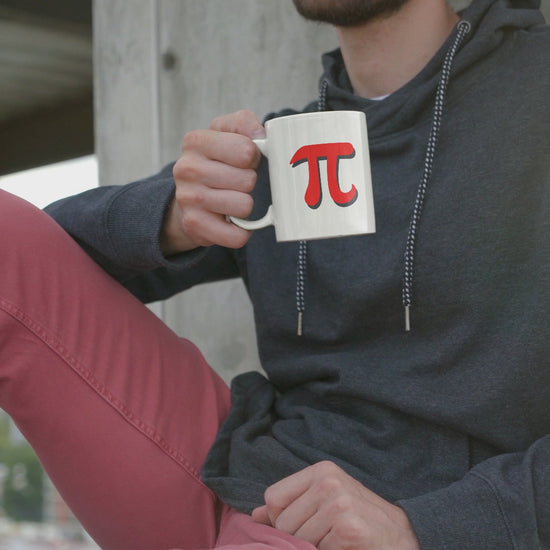 relaxed-man-sitting-holding-red-pi-mug