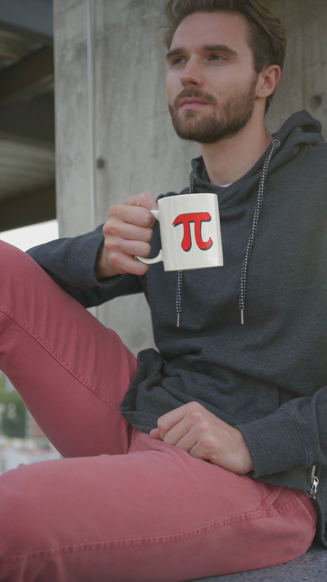 relaxed-man-sitting-holding-red-pi-mug