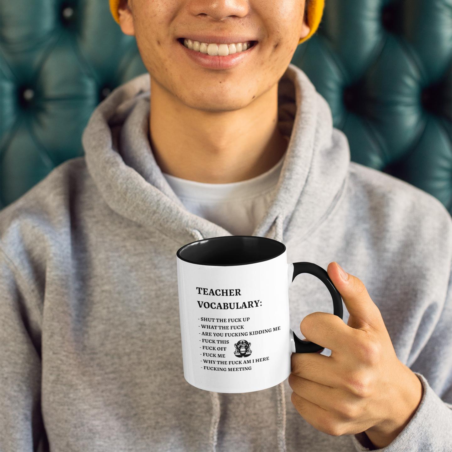 young-man-holding-rude-teacher-vocabulary-mug 