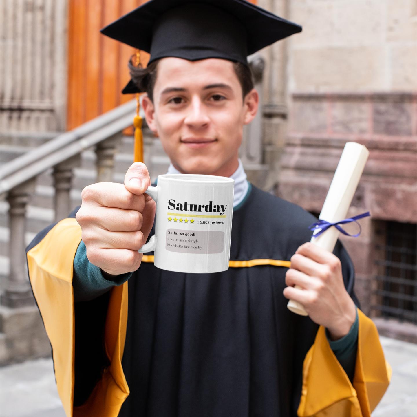 graduating-man-holding-funny-saturday-review-mug